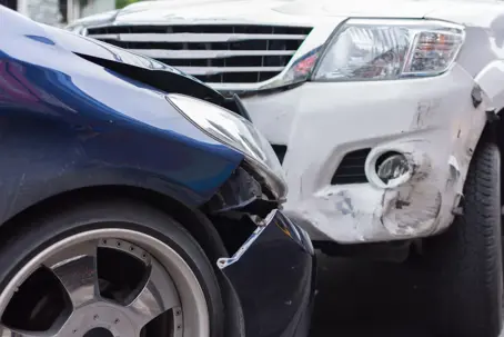 Front-end car crash with two cars