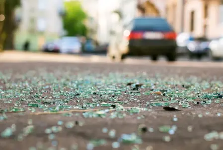 Shattered glass with a car in the background